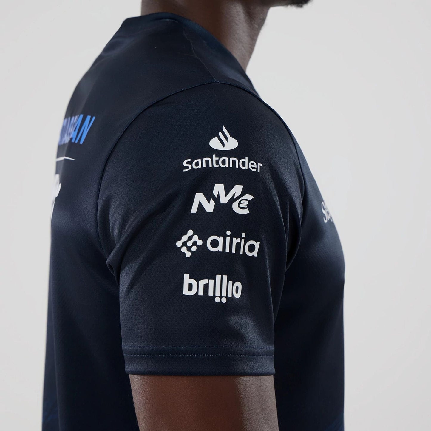 The model is wearing this Alex Albon Atlassian Williams F1 Team Tech T-shirt in navy. 6