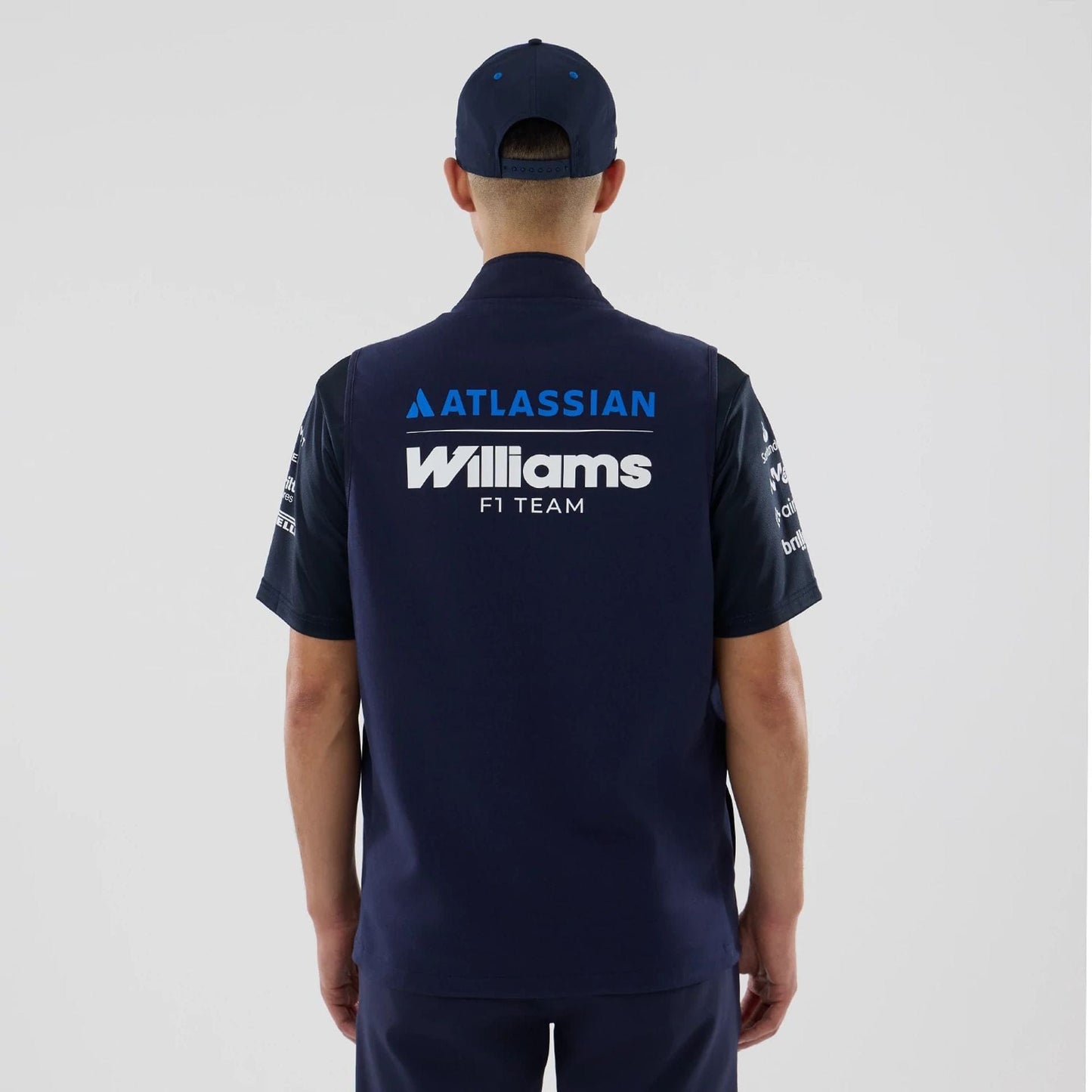 The model is wearing this Atlassian Williams F1 Team Gilet in navy. 2
