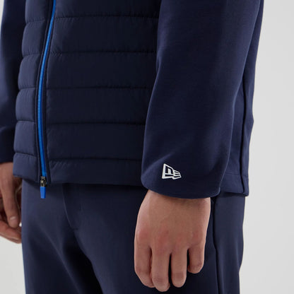 The model is wearing this Atlassian Williams F1 Team Hybrid Jacket in navy. 5