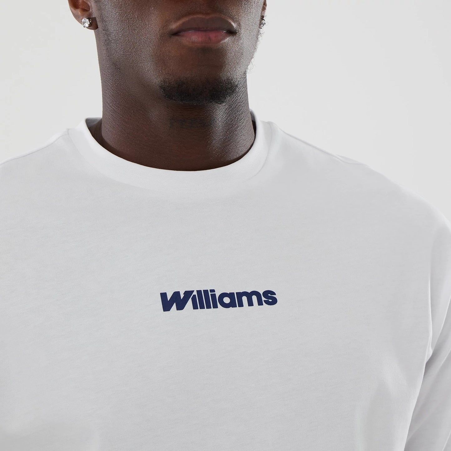 The model is wearing this Atlassian Williams F1 Team Japan 1996 Script World Champions Oversized T-Shirt in white. 4