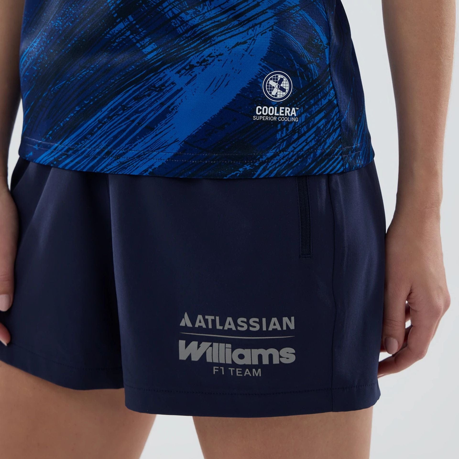 The model is wearing this Womens Atlassian Williams F1 Team Tech Polo T-shirt in navy. 7
