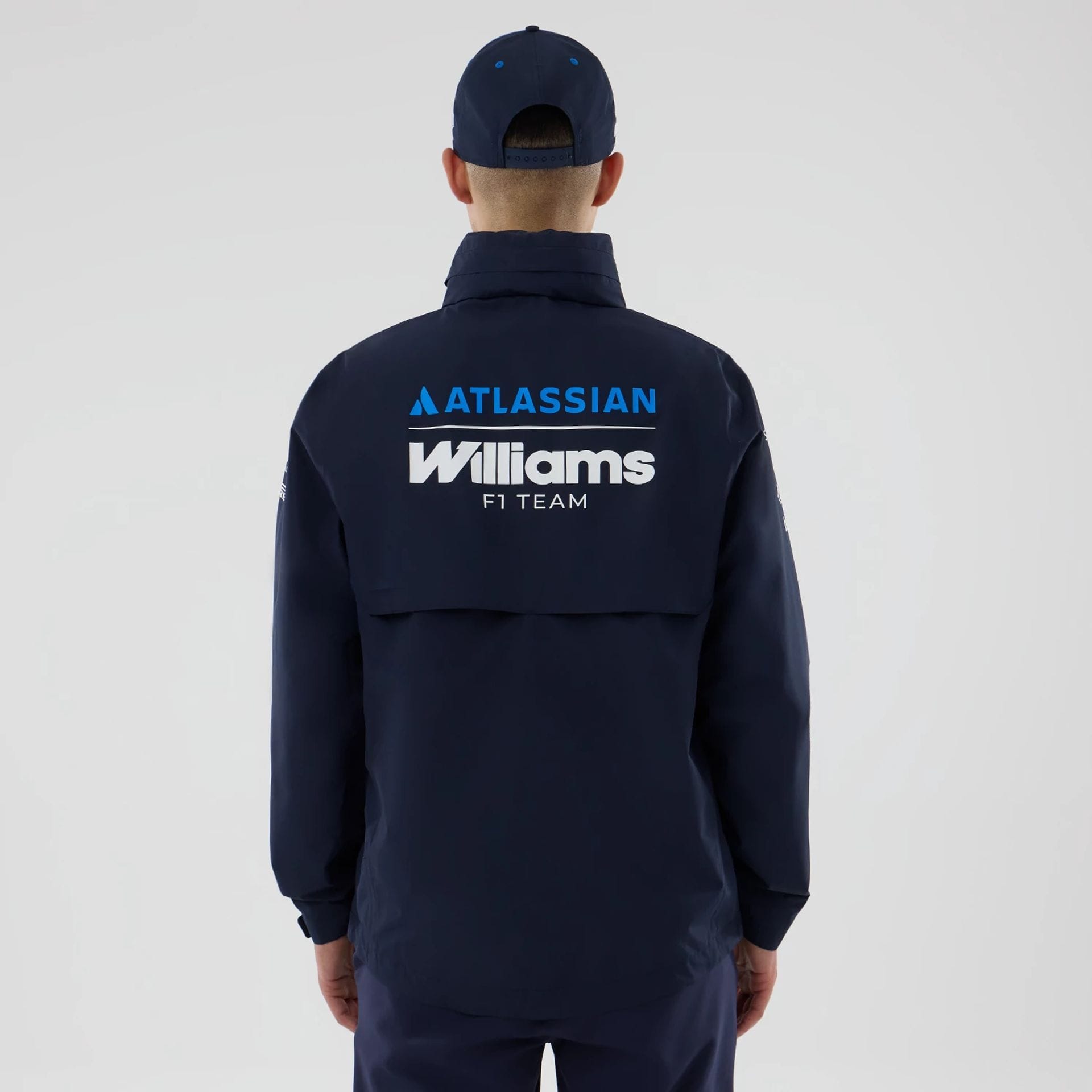 The model is wearing this Atlassian Williams F1 Team Rain Jacket in navy. 2