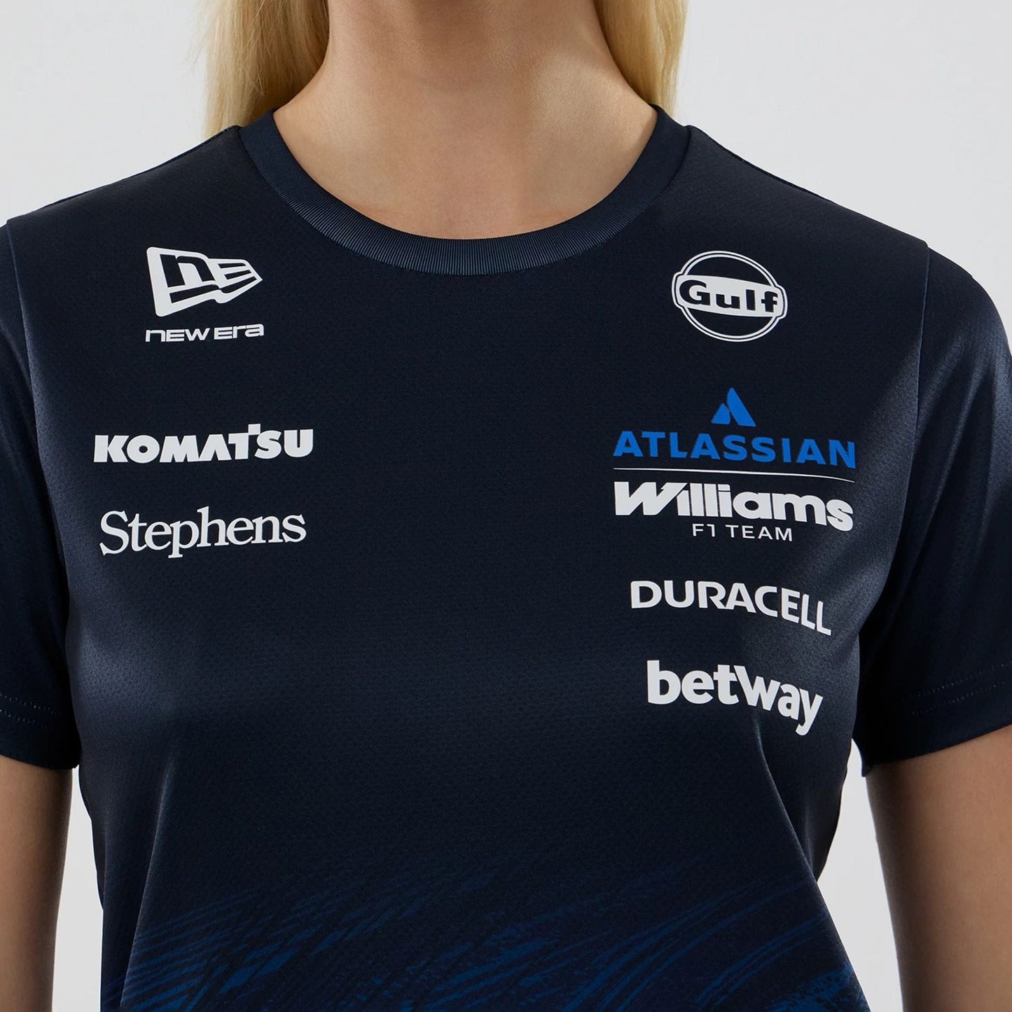 The model is wearing this Womens Carlos Sainz Atlassian Williams F1 Team Tech T-shirt in navy. 4