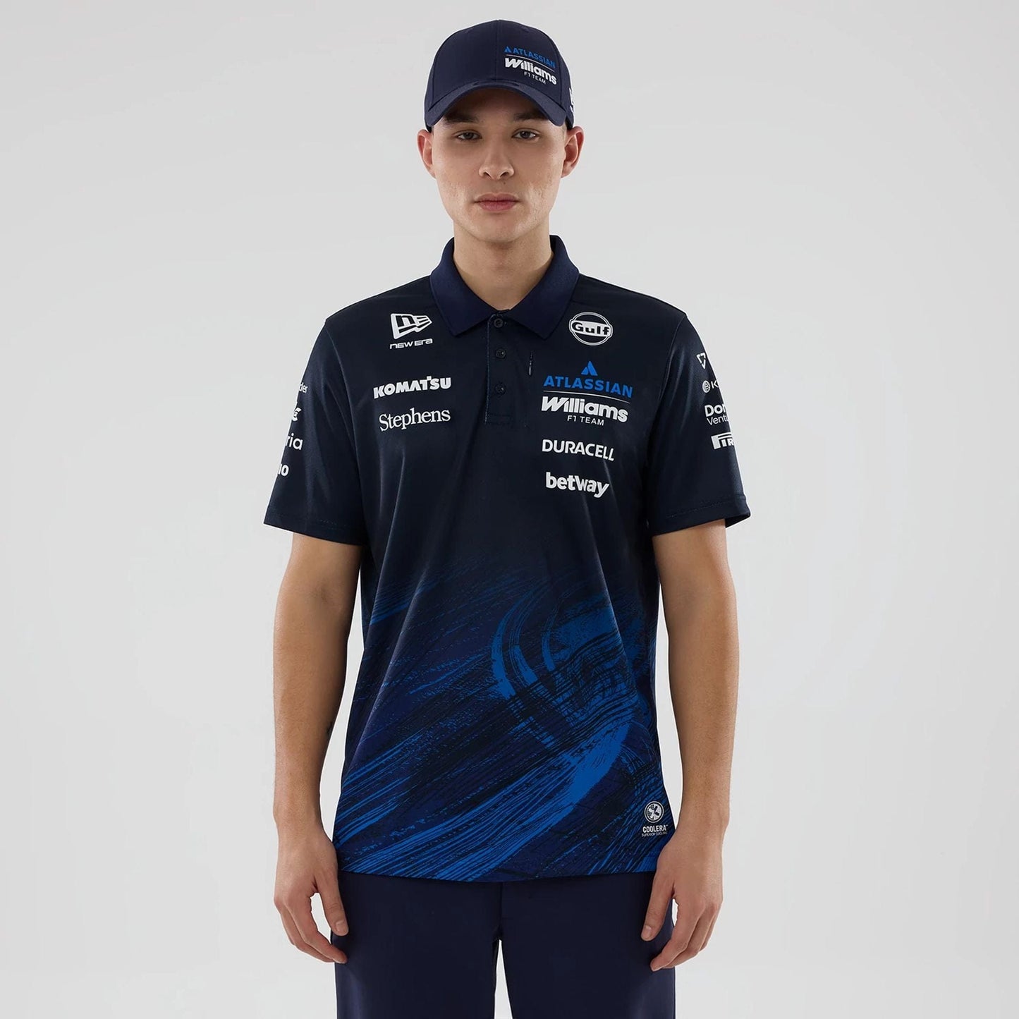 The model is wearing this Atlassian Williams F1 Team Tech Polo T-shirt in navy. 1