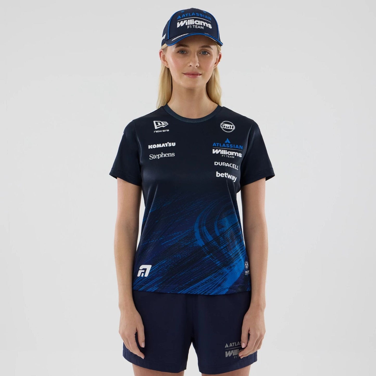 The model is wearing this Womens Alex Albon Atlassian Williams F1 Team Tech T-shirt in navy. 1