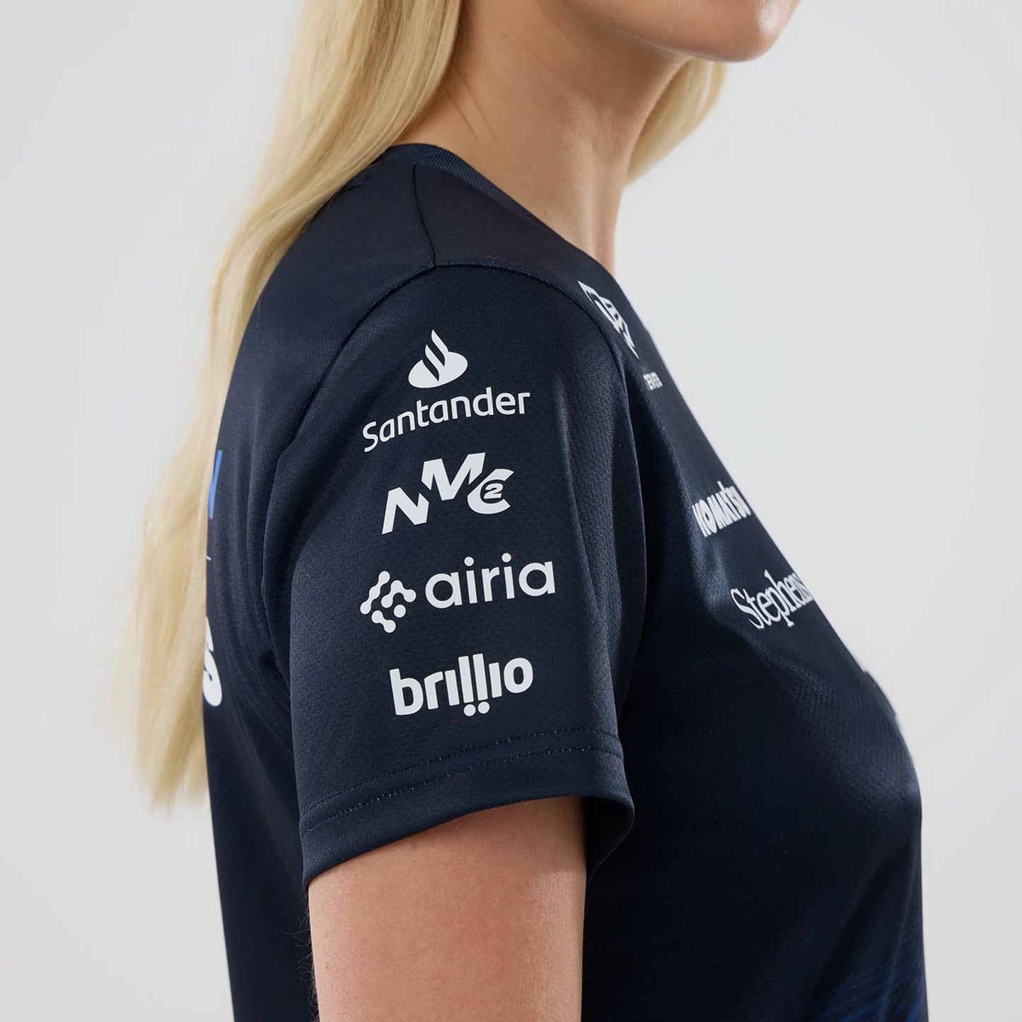 The model is wearing this Womens Alex Albon Atlassian Williams F1 Team Tech T-shirt in navy. 5