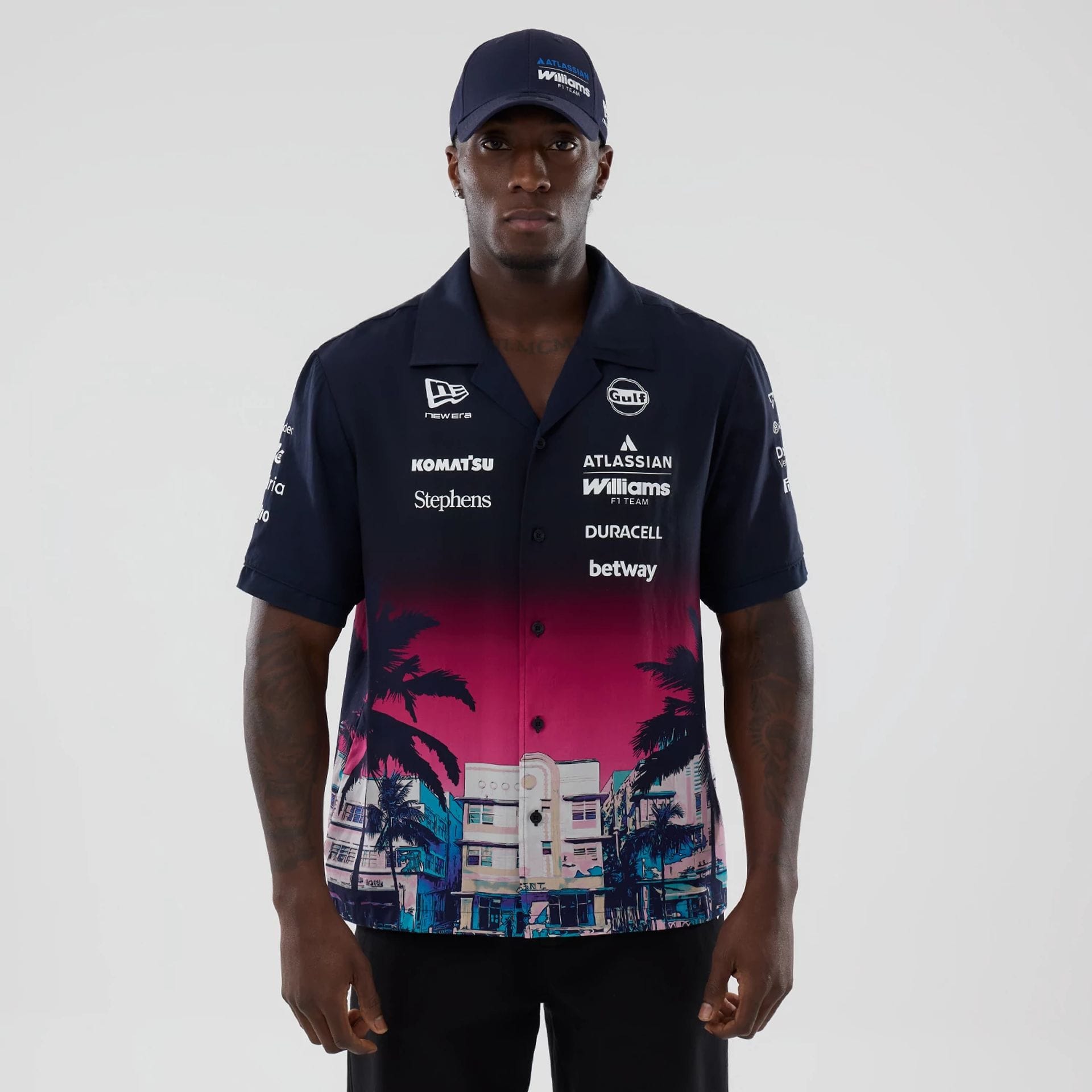 The model is wearing this Miami Atlassian Williams F1 Team Short Sleeve Shirt in navy. 1