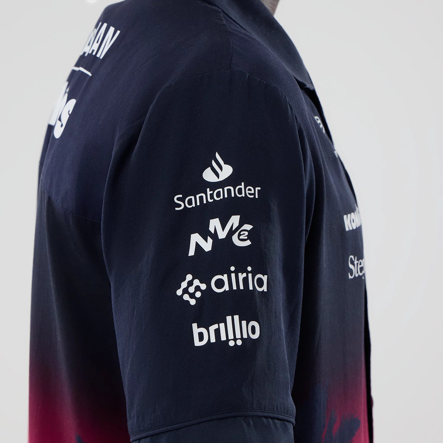 The model is wearing this Miami Atlassian Williams F1 Team Short Sleeve Shirt in navy. 4