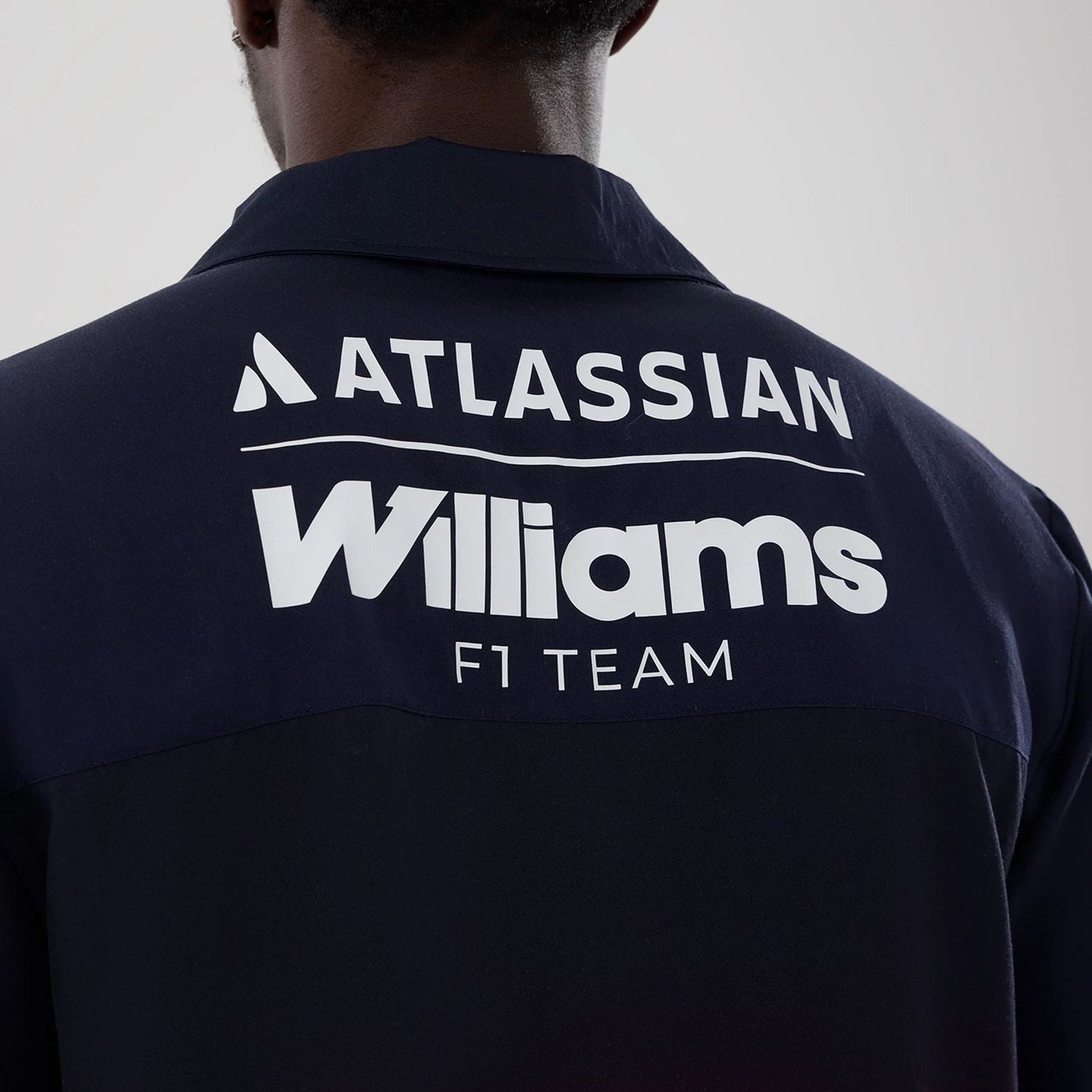 The model is wearing this Miami Atlassian Williams F1 Team Short Sleeve Shirt in navy. 7