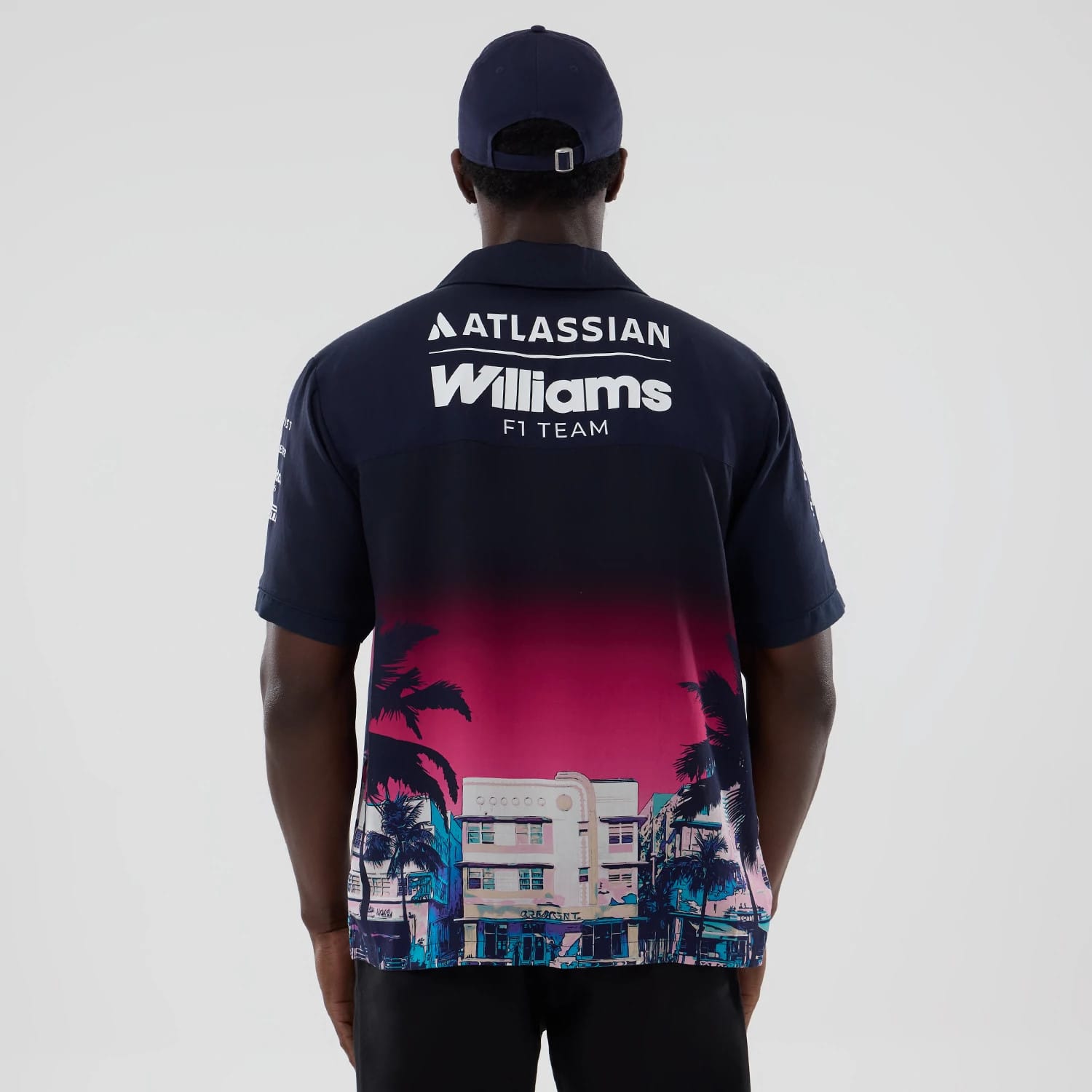 The model is wearing this Miami Atlassian Williams F1 Team Short Sleeve Shirt in navy. 2