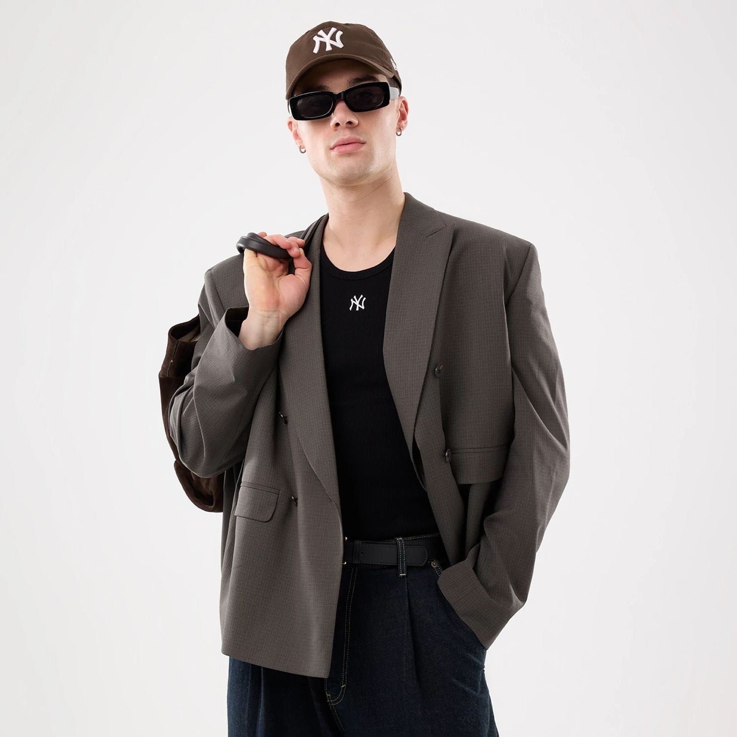 The model is wearing this MLB Rib New York Yankees Vest in black. 5