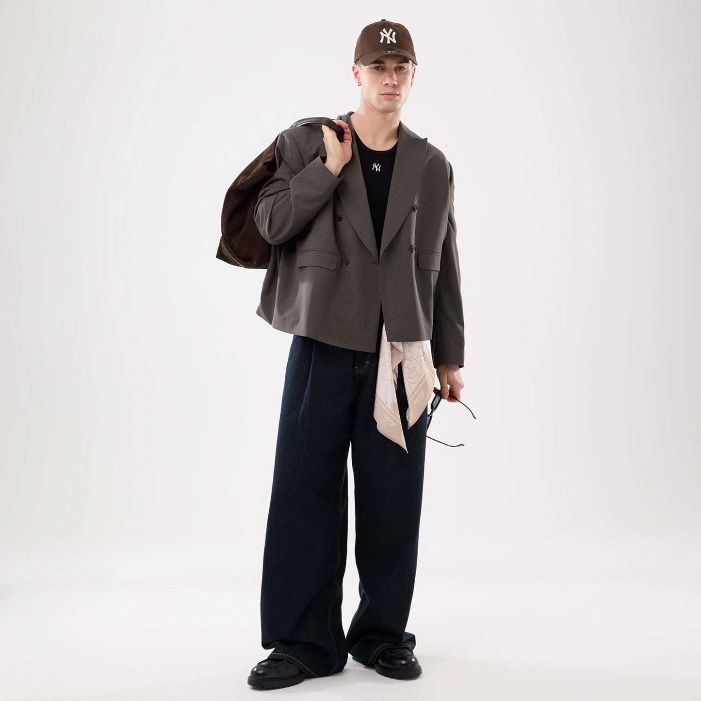 The model is wearing this MLB Rib New York Yankees Vest in black. 6