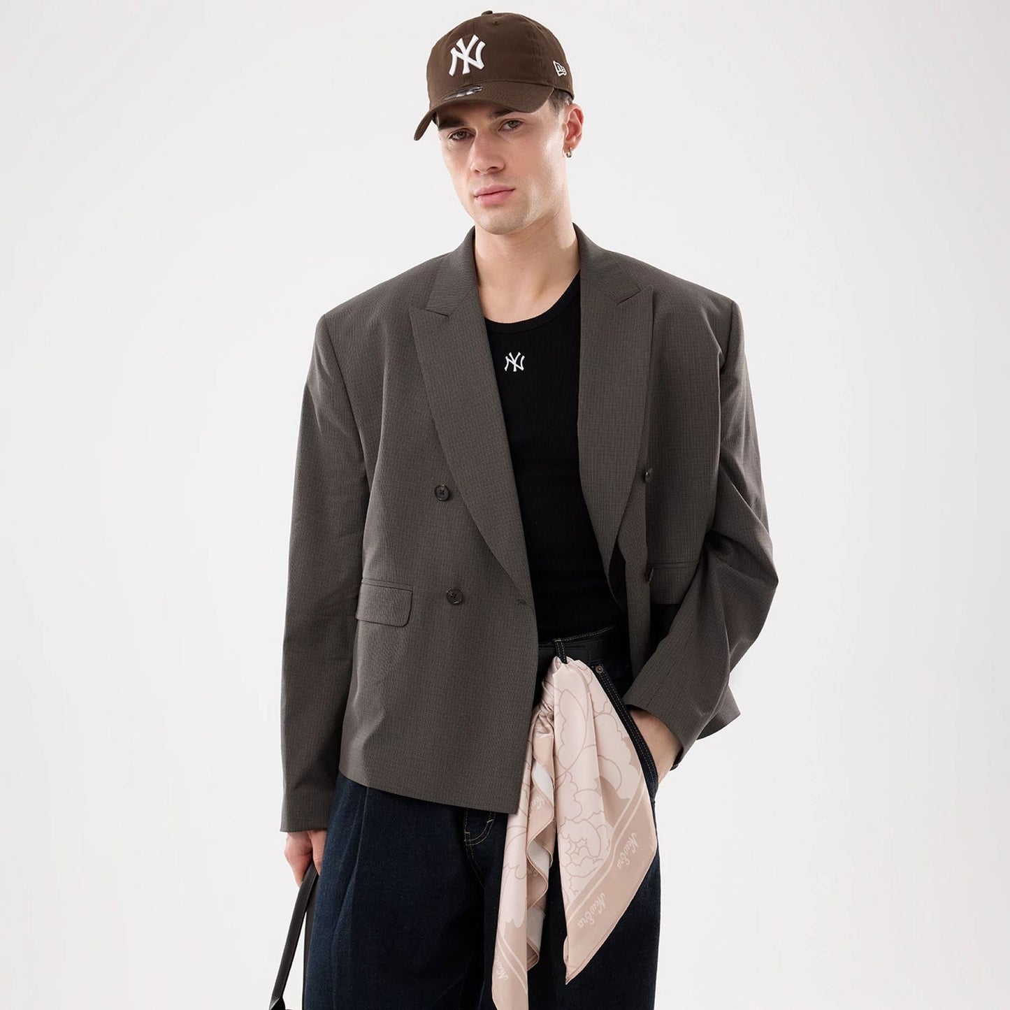 The model is wearing this MLB Rib New York Yankees Vest in black. 7