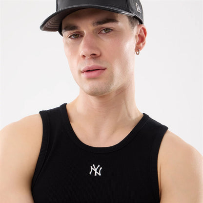 The model is wearing this MLB Rib New York Yankees Vest in black. 10