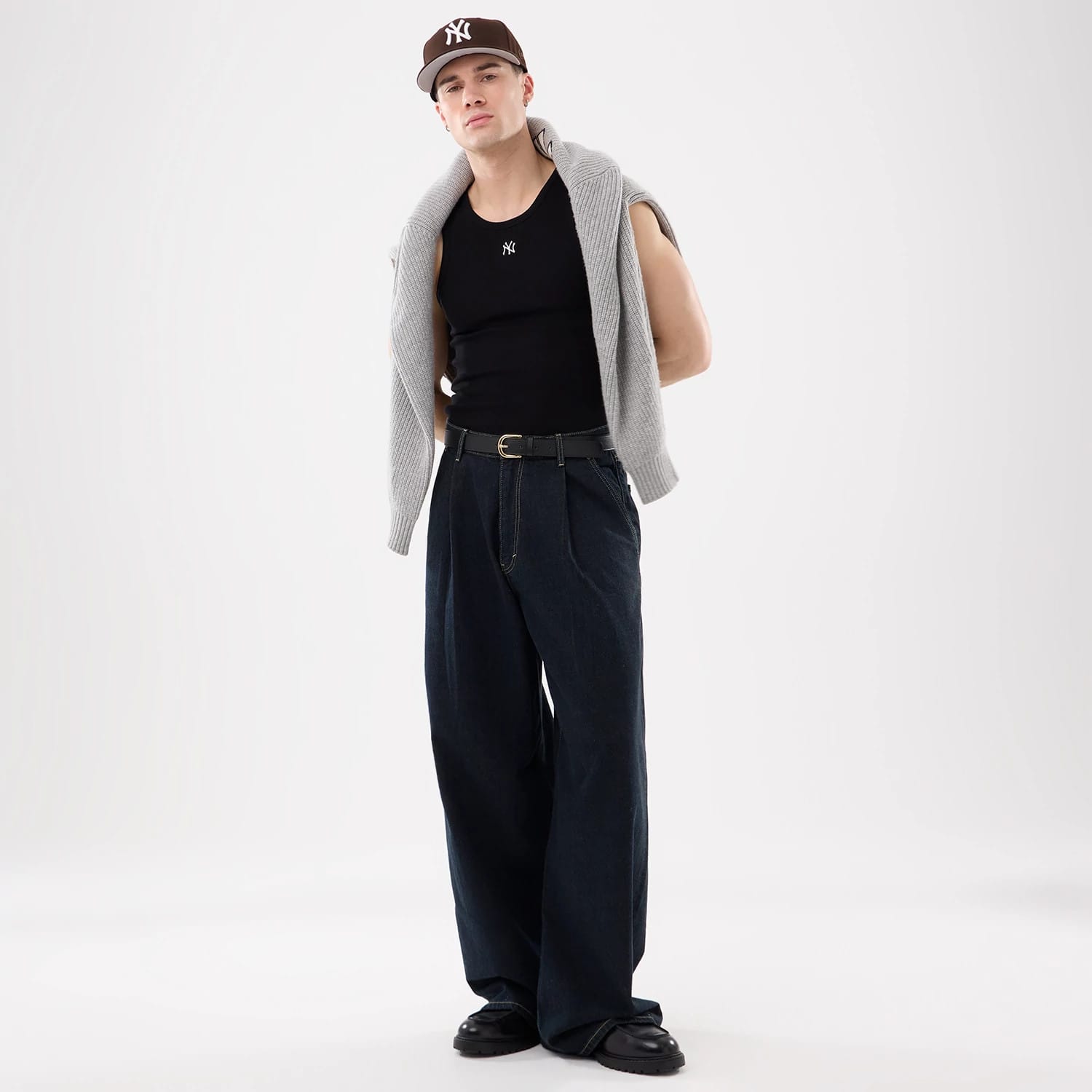 The model is wearing this MLB Rib New York Yankees Vest in black. 12