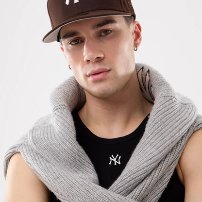 The model is wearing this MLB Rib New York Yankees Vest in black. 18