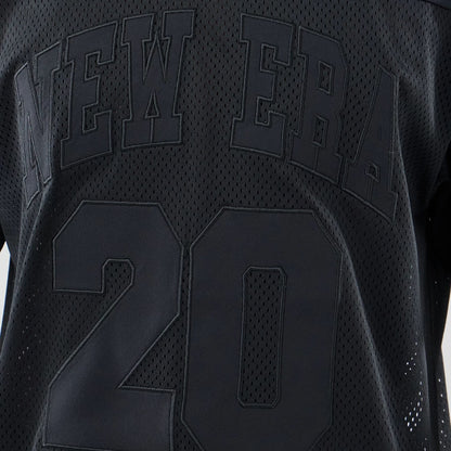 The model is wearing this New Era Mesh Oversized T-Shirt in black. 4