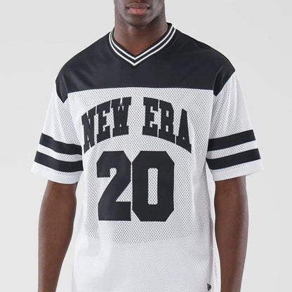 The model is wearing this New Era Mesh Oversized T-Shirt in white. 3