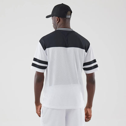 The model is wearing this New Era Mesh Oversized T-Shirt in white. 2