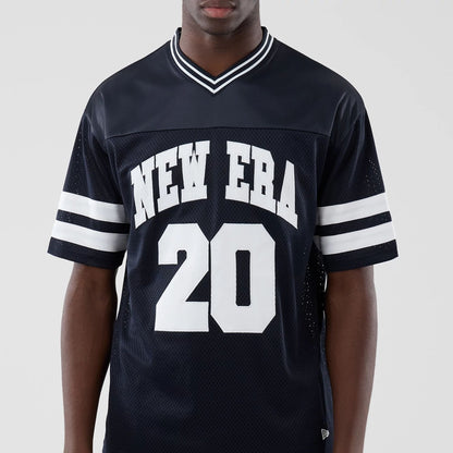 The model is wearing this New Era Mesh Oversized T-Shirt in navy. 3