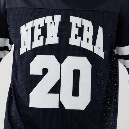 The model is wearing this New Era Mesh Oversized T-Shirt in navy. 4