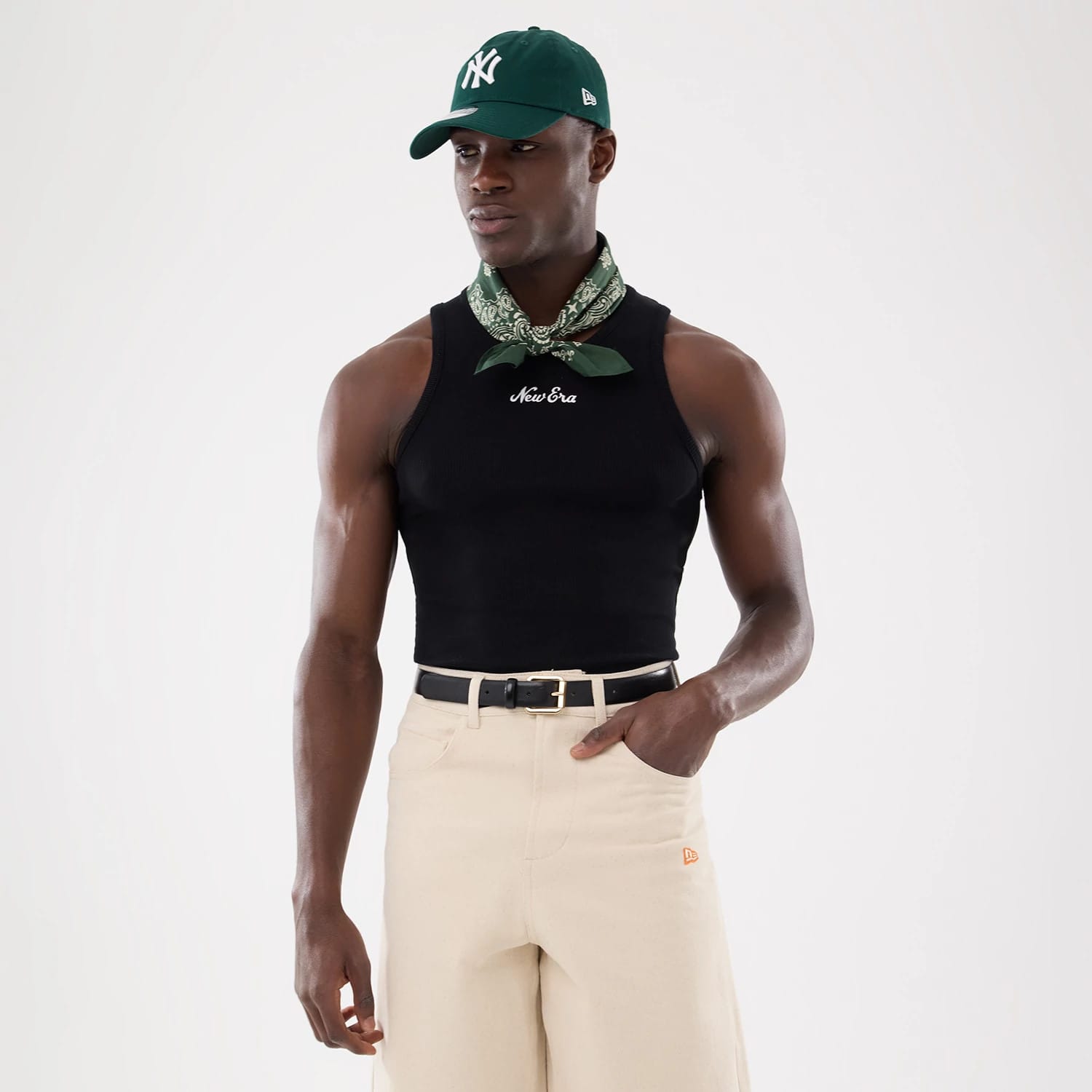 The model is wearing this New Era Rib Vest in black. 1