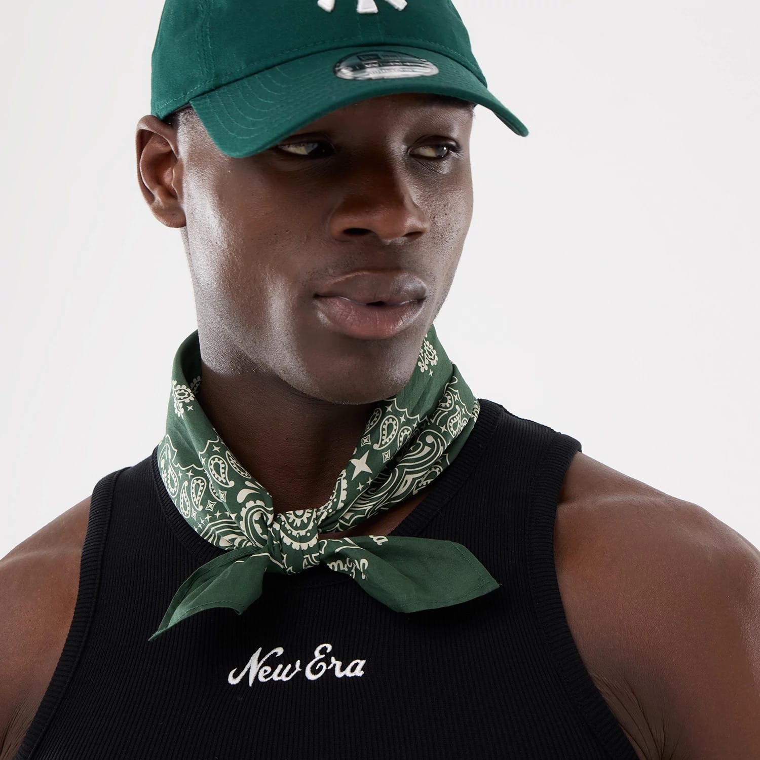 The model is wearing this New Era Rib Vest in black. 14