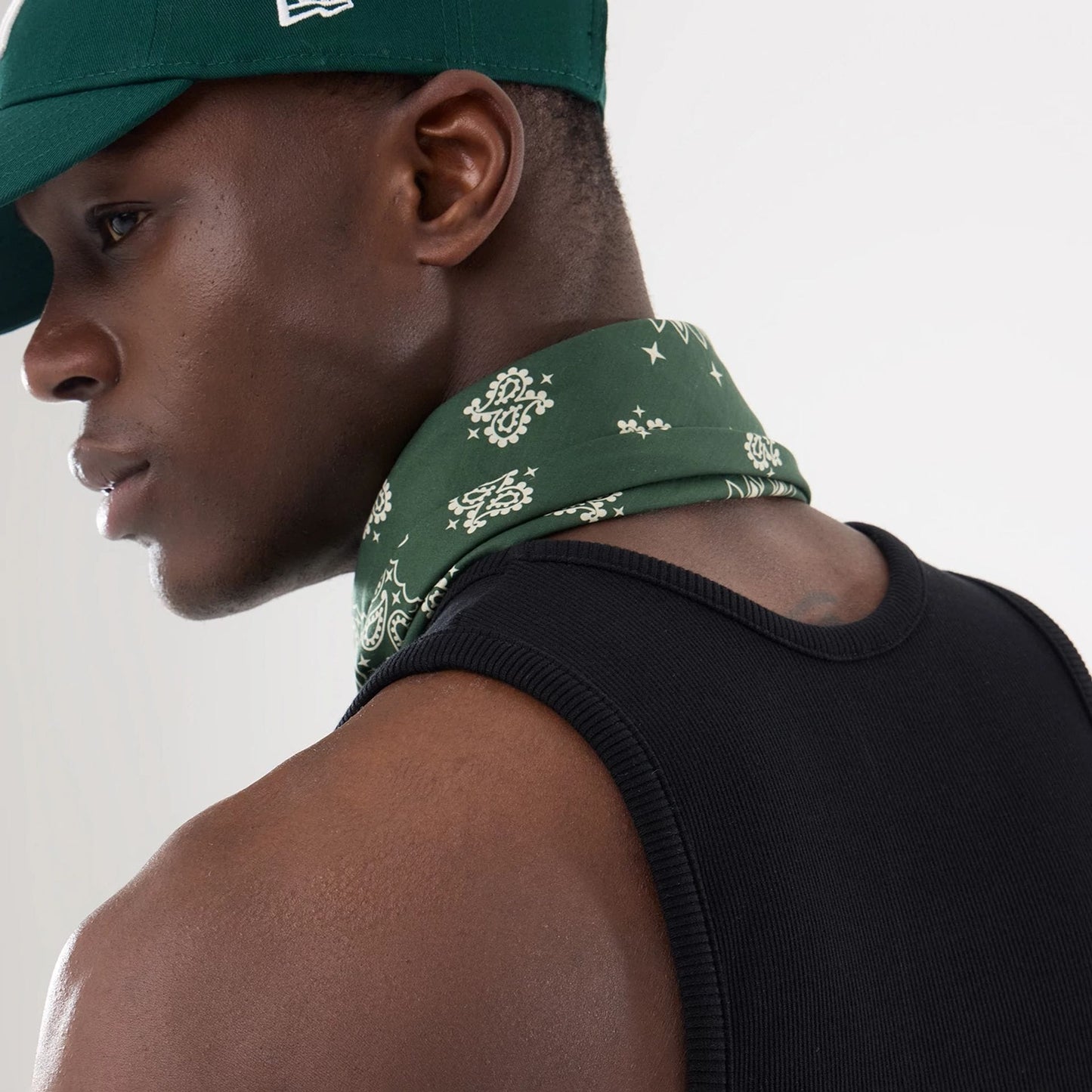 The model is wearing this New Era Rib Vest in black. 15