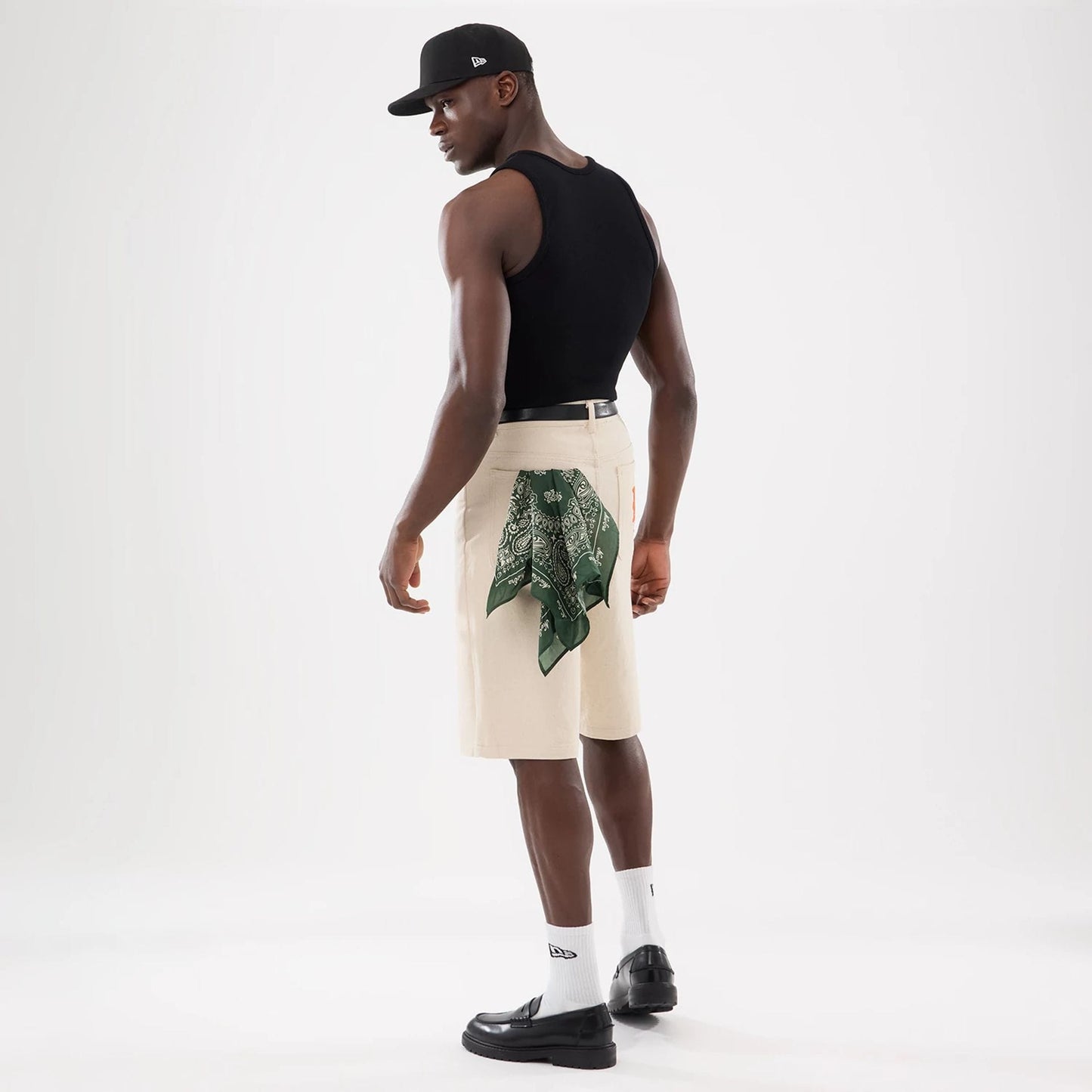 The model is wearing this New Era Rib Vest in black. 17