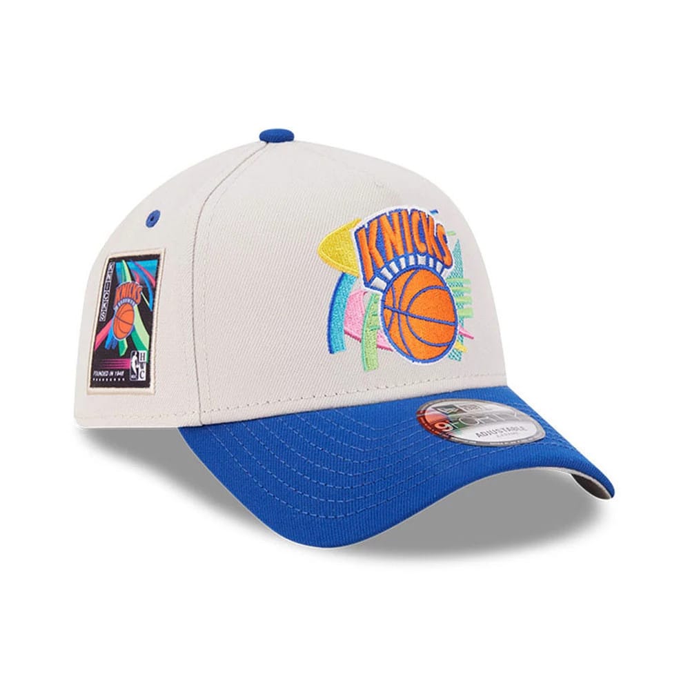 Pictured is this NBA Hardwood Classic New York Knicks 9FORTY A-Frame Adjustable cap in light beige. 1