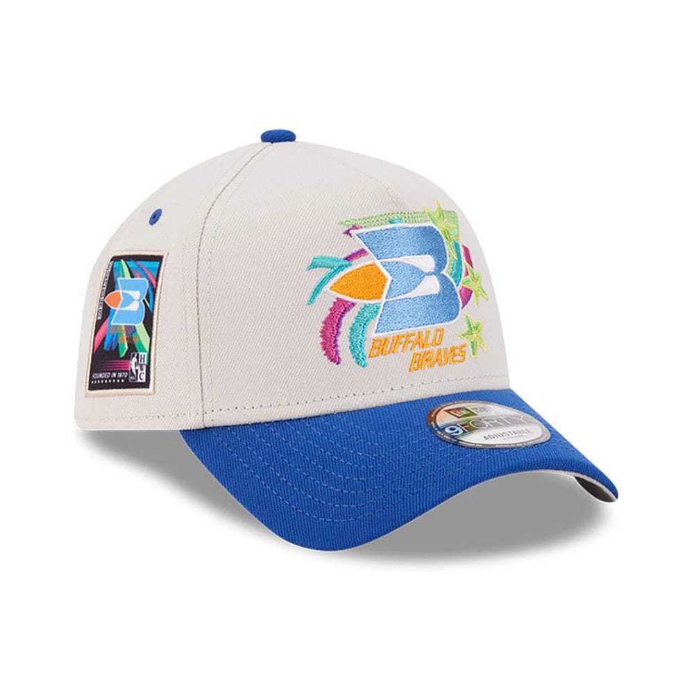 Pictured is this NBA Hardwood Classic Buffalo Braves 9FORTY A-Frame Adjustable cap in light beige. 1