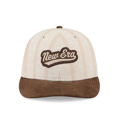 New Era 59FIFTY Day Open Beige Low Profile 59FIFTY Fitted Cap, front view showing the raised brown embroidered New Era script logo on the centre of the beige crown with light brown pinstripes, and a brown flat visor.