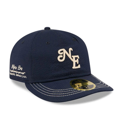 New Era 59FIFTY Day Seersucker Navy Retro Crown 59FIFTY Fitted Cap, front view showing the cream NE logo embroidered on the front panel, white New Era script on the side, dark navy seersucker fabric and a gold 59FIFTY size sticker on the visor.