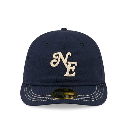 Pictured is this New Era 59FIFTY Day Seersucker Retro Crown 59FIFTY Fitted cap in navy. 2