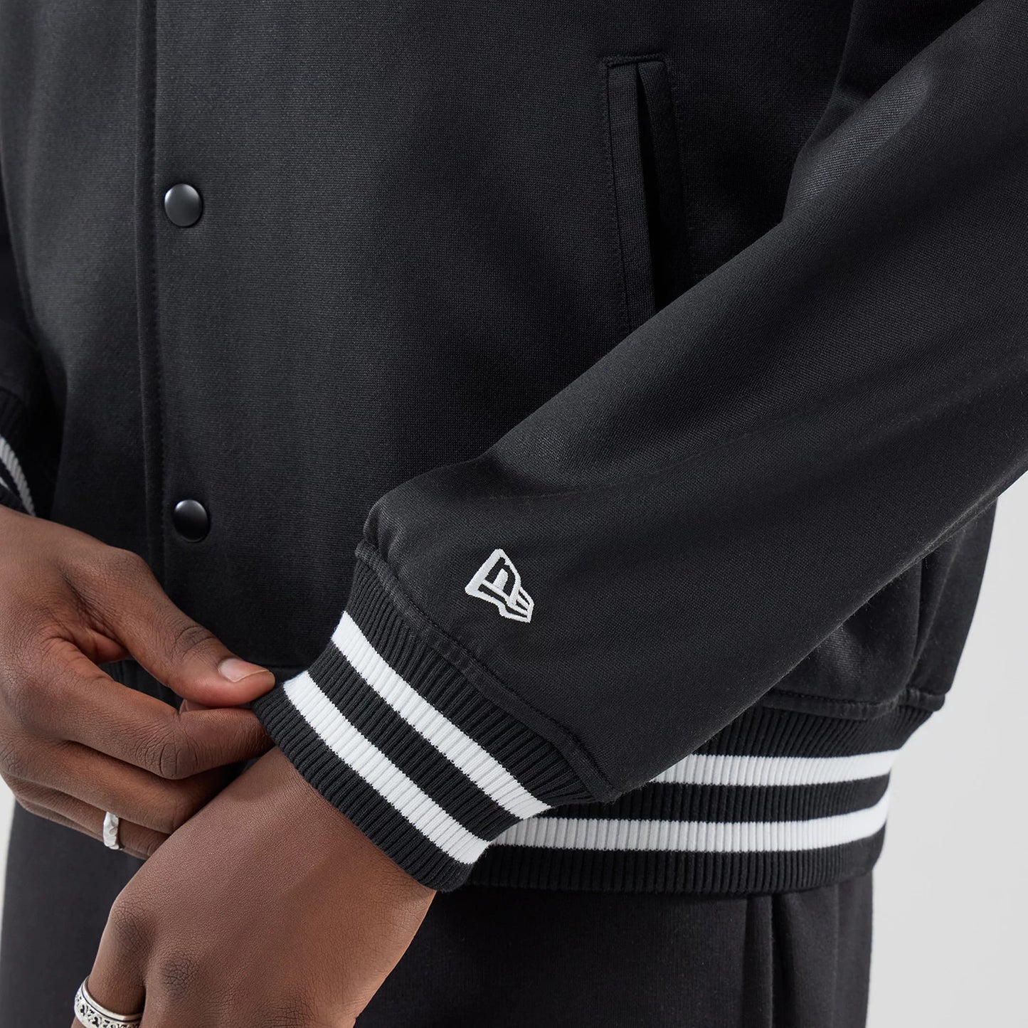 The model is wearing this MLB Jersey Bomber Detroit Tigers Jacket in black. 5