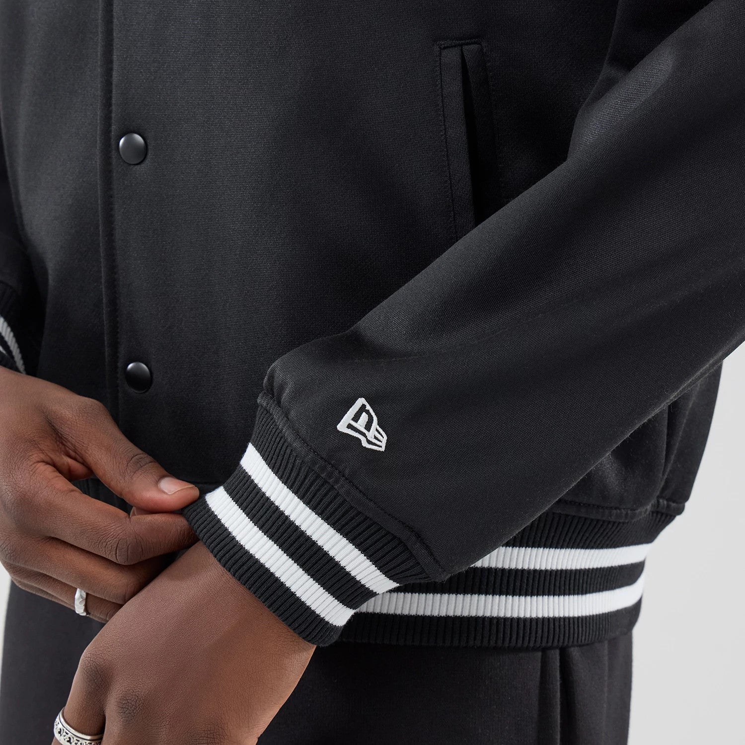 The model is wearing this MLB Jersey Bomber Detroit Tigers Jacket in black. 5