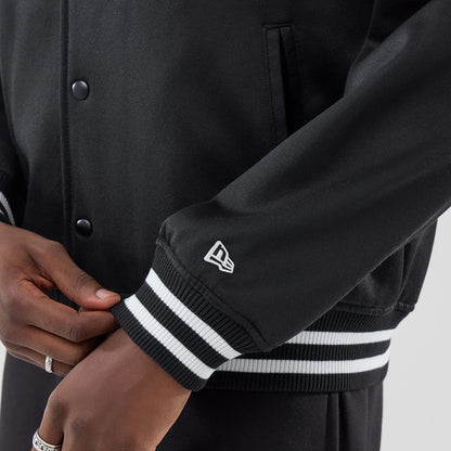 The model is wearing this MLB Jersey Bomber Detroit Tigers Jacket in black. 5