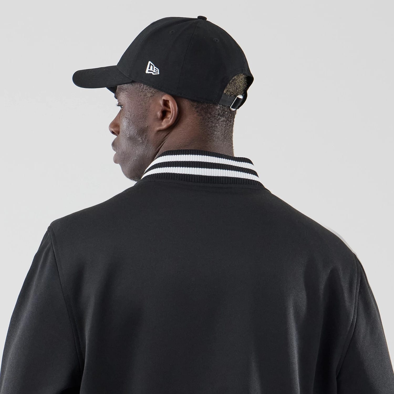 The model is wearing this MLB Jersey Bomber Detroit Tigers Jacket in black. 7