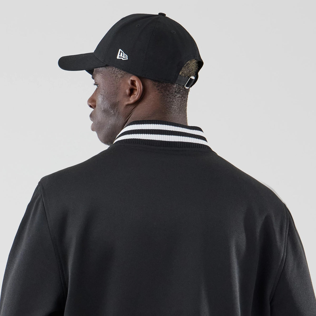 The model is wearing this MLB Jersey Bomber Detroit Tigers Jacket in black. 7