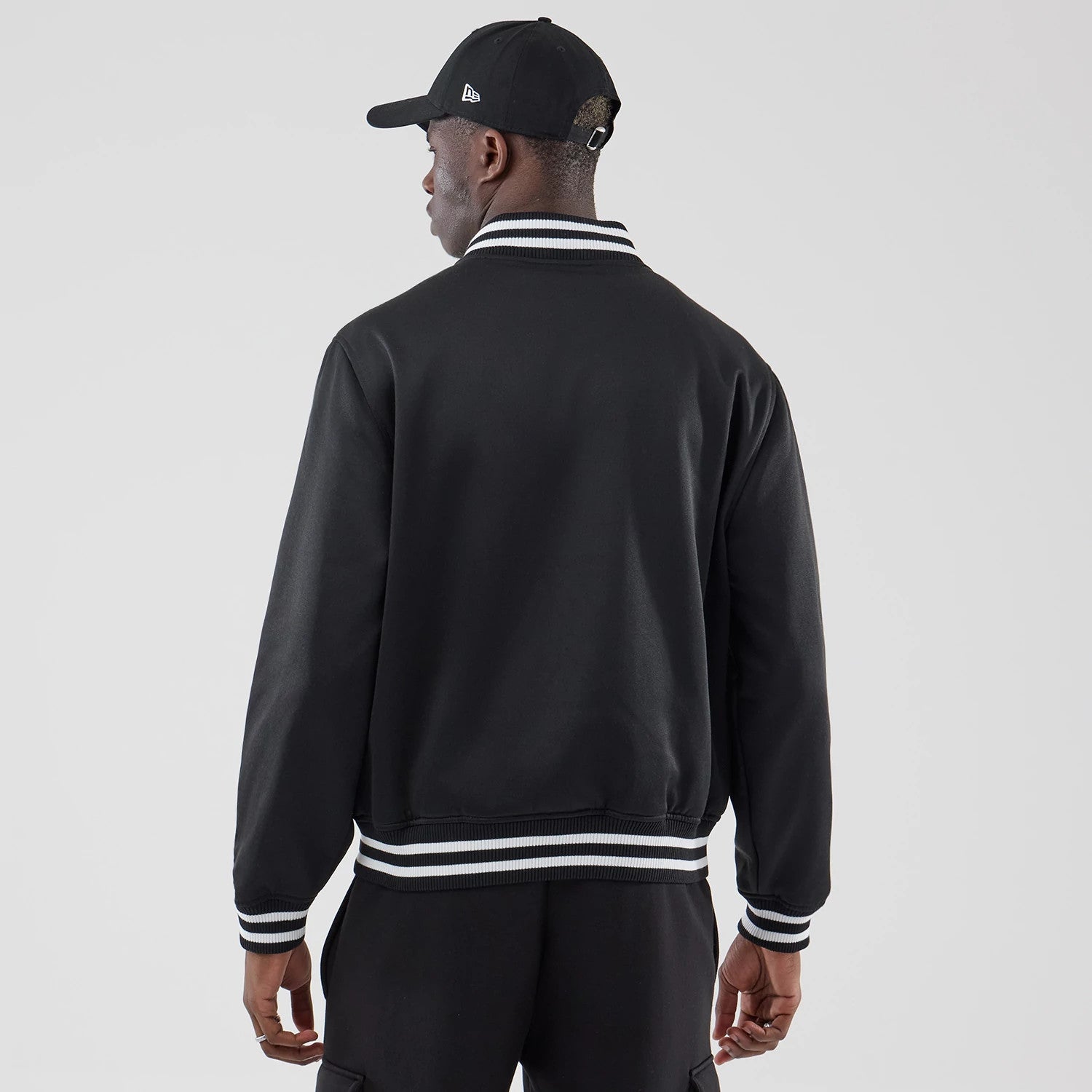 The model is wearing this MLB Jersey Bomber Detroit Tigers Jacket in black. 2