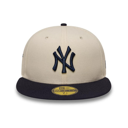 Pictured is this MLB Side Script New York Yankees 59FIFTY Fitted cap in cream & navy. 2