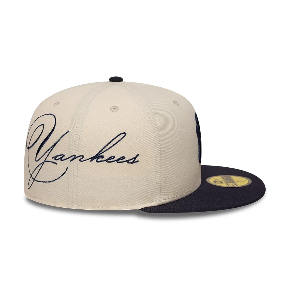 Pictured is this MLB Side Script New York Yankees 59FIFTY Fitted cap in Cream. 3