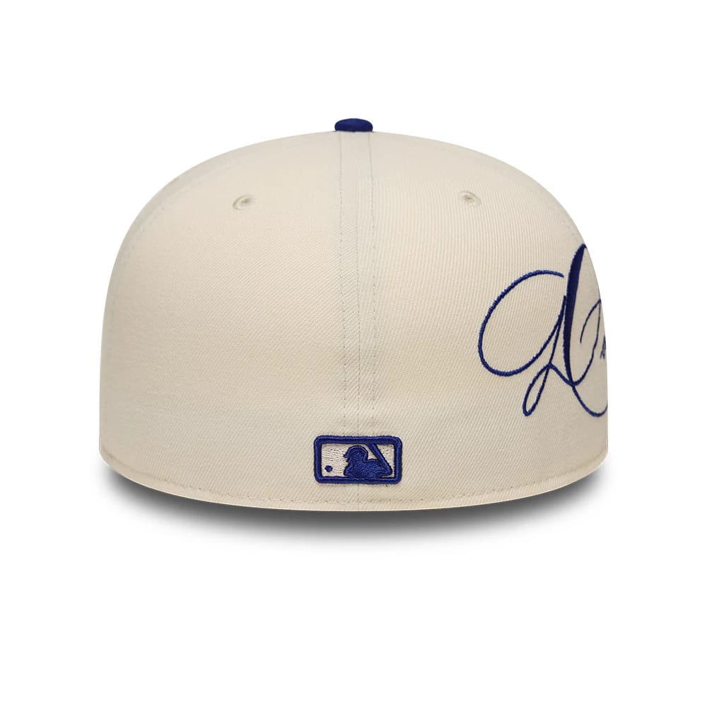 Pictured is this MLB Side Script LA Dodgers 59FIFTY Fitted cap in cream & blue. 3
