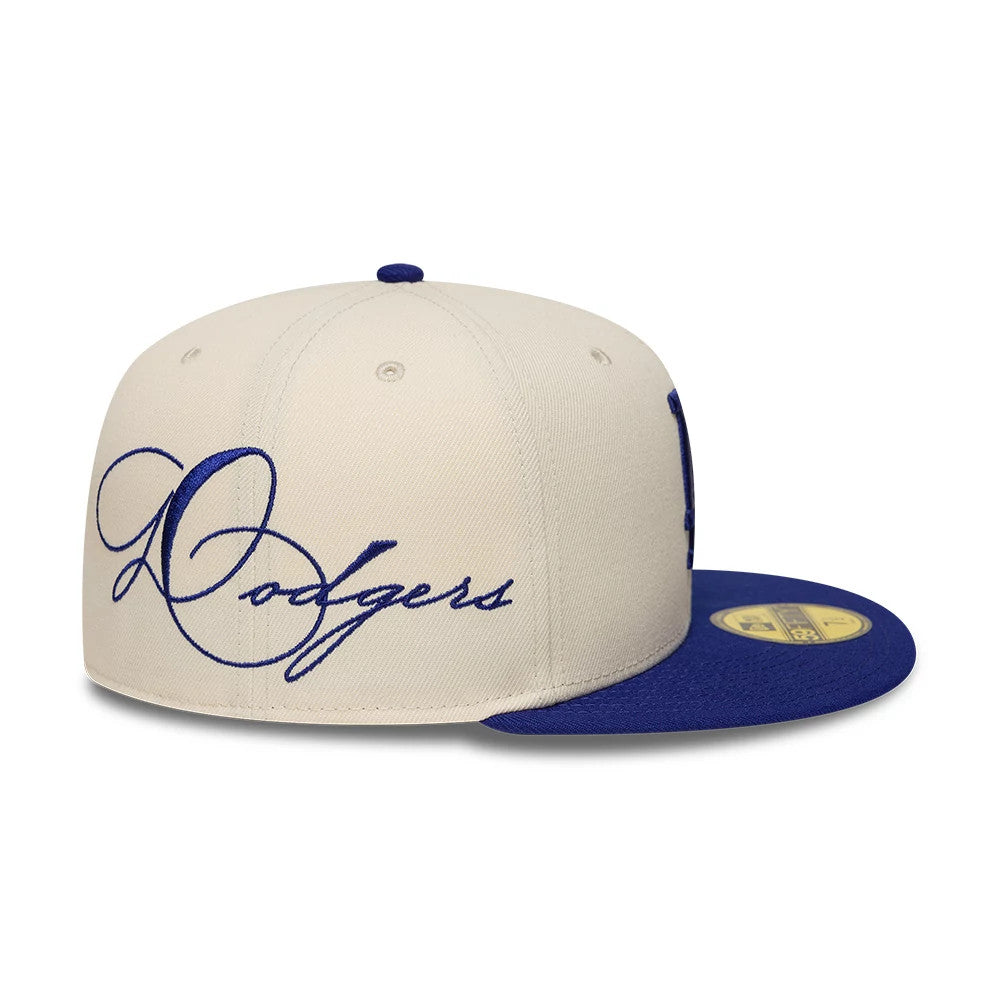 Pictured is this MLB Side Script LA Dodgers 59FIFTY Fitted cap in cream & blue. 3