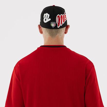The model is wearing this LMB Mexico Diablos Oversized T-Shirt in red. 7