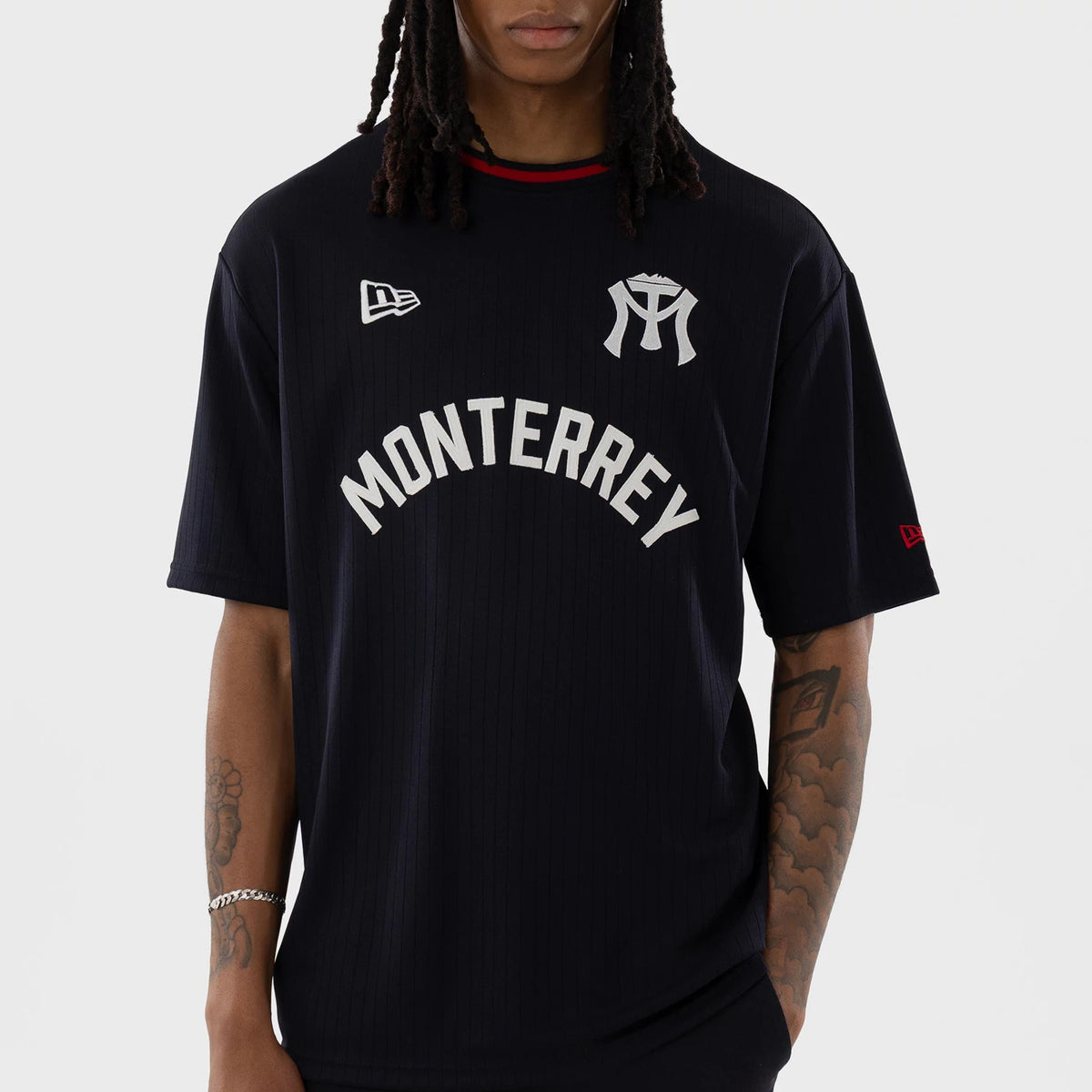 New Era Sultanes De Monterrey LMB Navy Oversized T-Shirt, front view showing Monterrey lettering in white across the chest, an emblem on the upper right side, and the embroidered New Era logo on the left shoulder of the navy oversized fit.