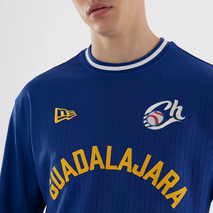 New Era Charros De Jalisco LMB Blue Oversized T-Shirt, front view showing an embroidered Guadalajara in yellow across the chest, a yellow embroidered New Era logo on the upper chest, and a white embroidered baseball motif with Ch on the shoulder.