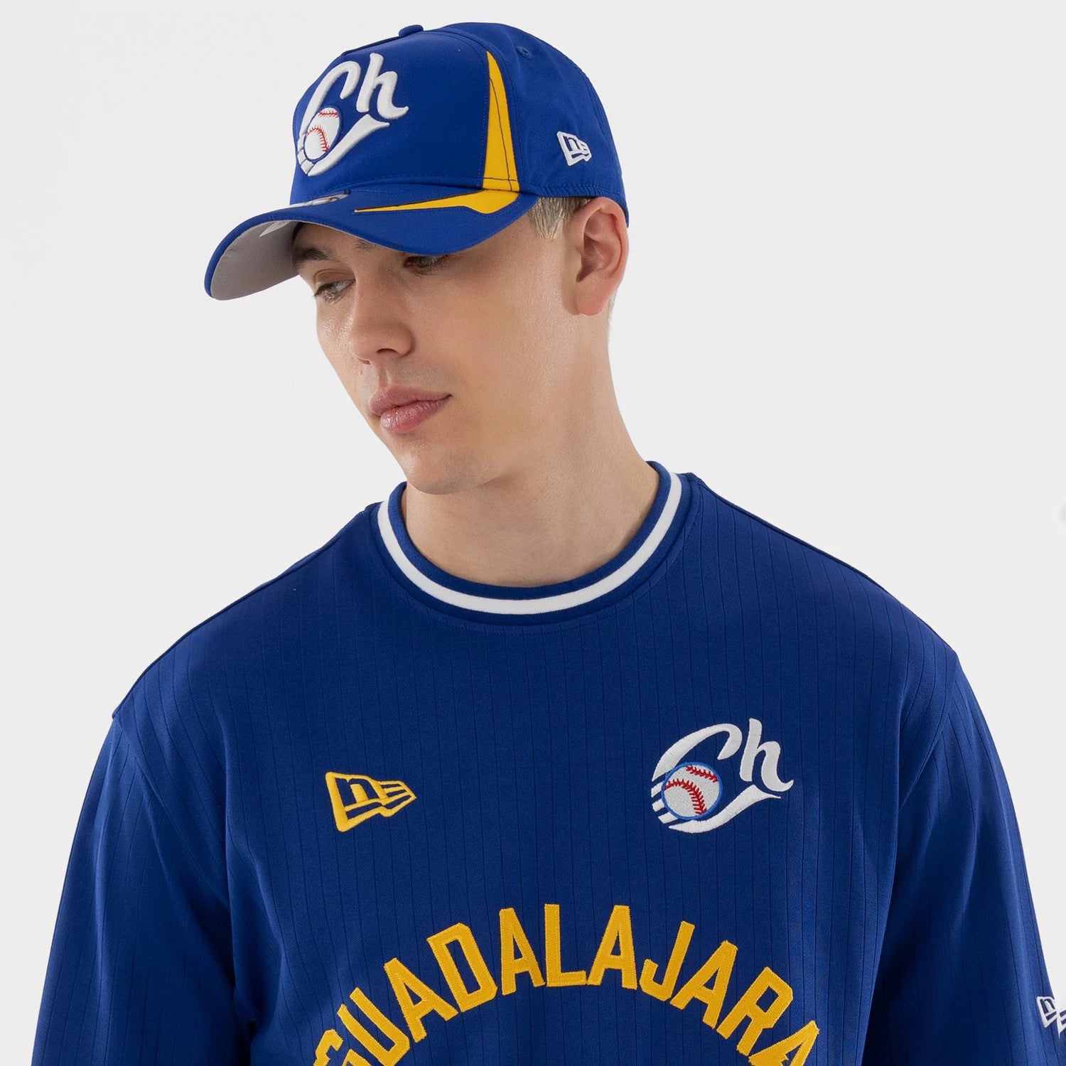 The model is wearing this LMB Charros De Jalisco Oversized T-Shirt in blue. 3