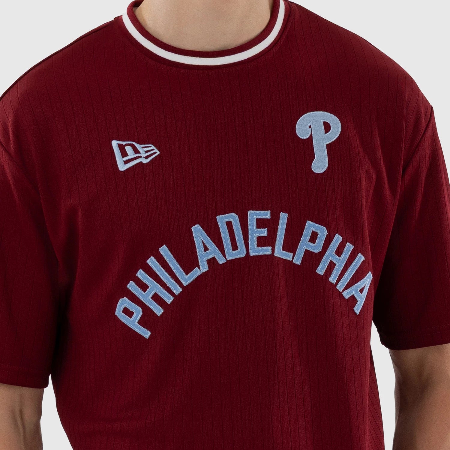 The model is wearing this MLB Philadelphia Phillies Oversized T-Shirt in dark red. 4