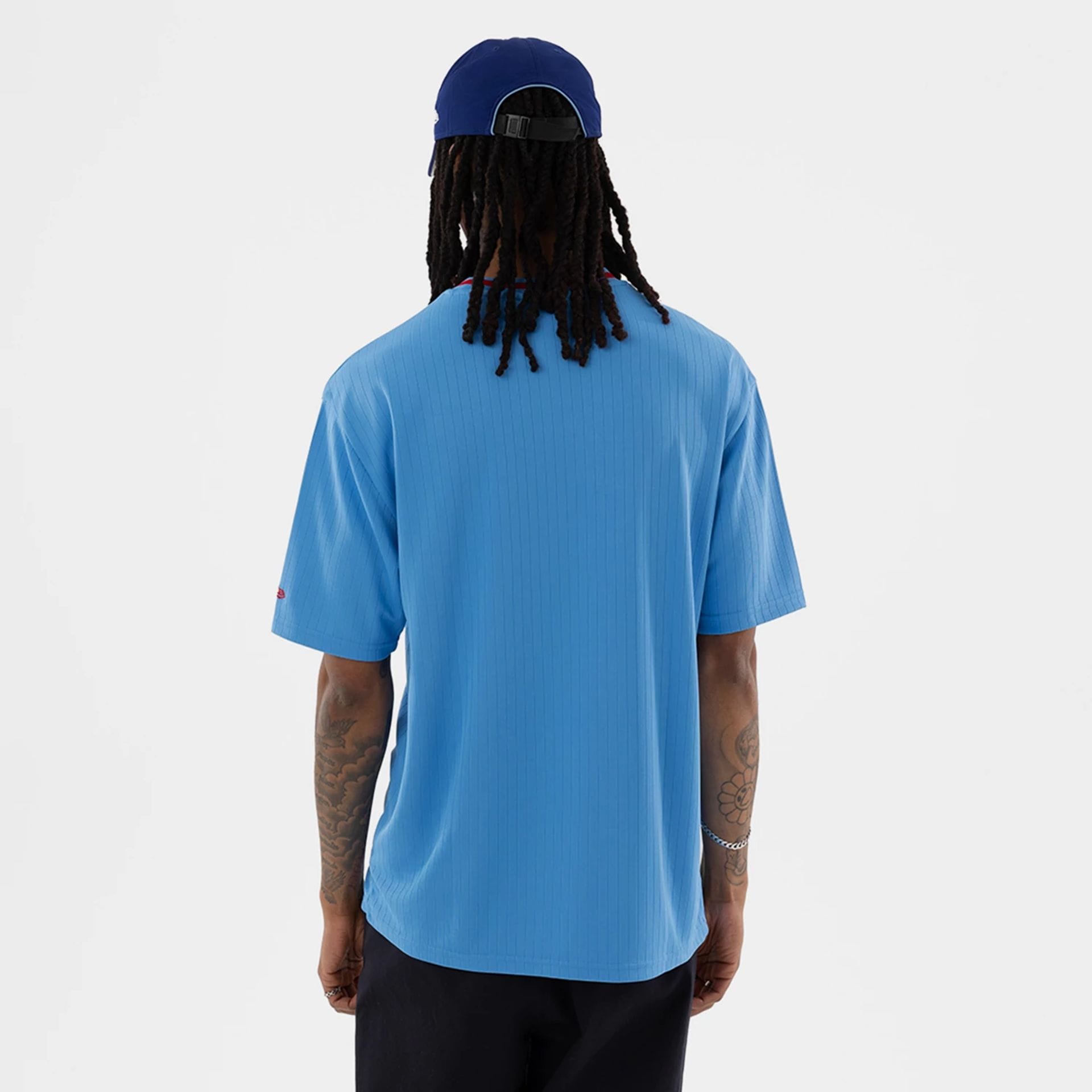 The model is wearing this MLB Texas Rangers T-Shirt in pastel blue. 2